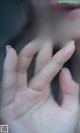 A close up of a woman's hand with her fingers outstretched.