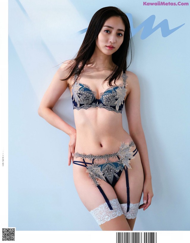 A woman in lingerie posing for a magazine cover.