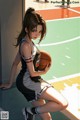 A woman holding a basketball on a basketball court.